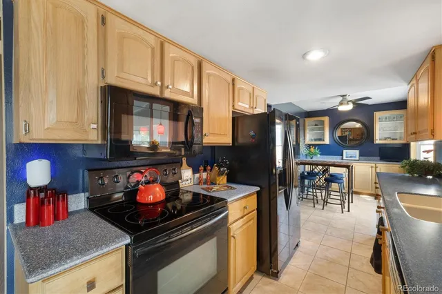 a kitchen with stainless steel appliances granite countertop a stove and a sink