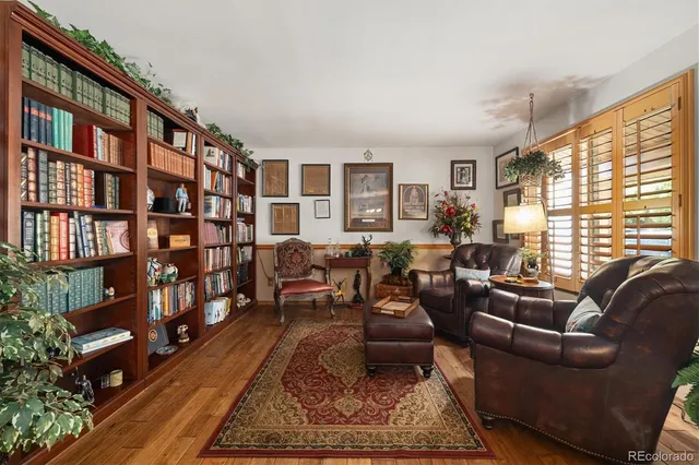 a living room with furniture or bookshelf and a large window