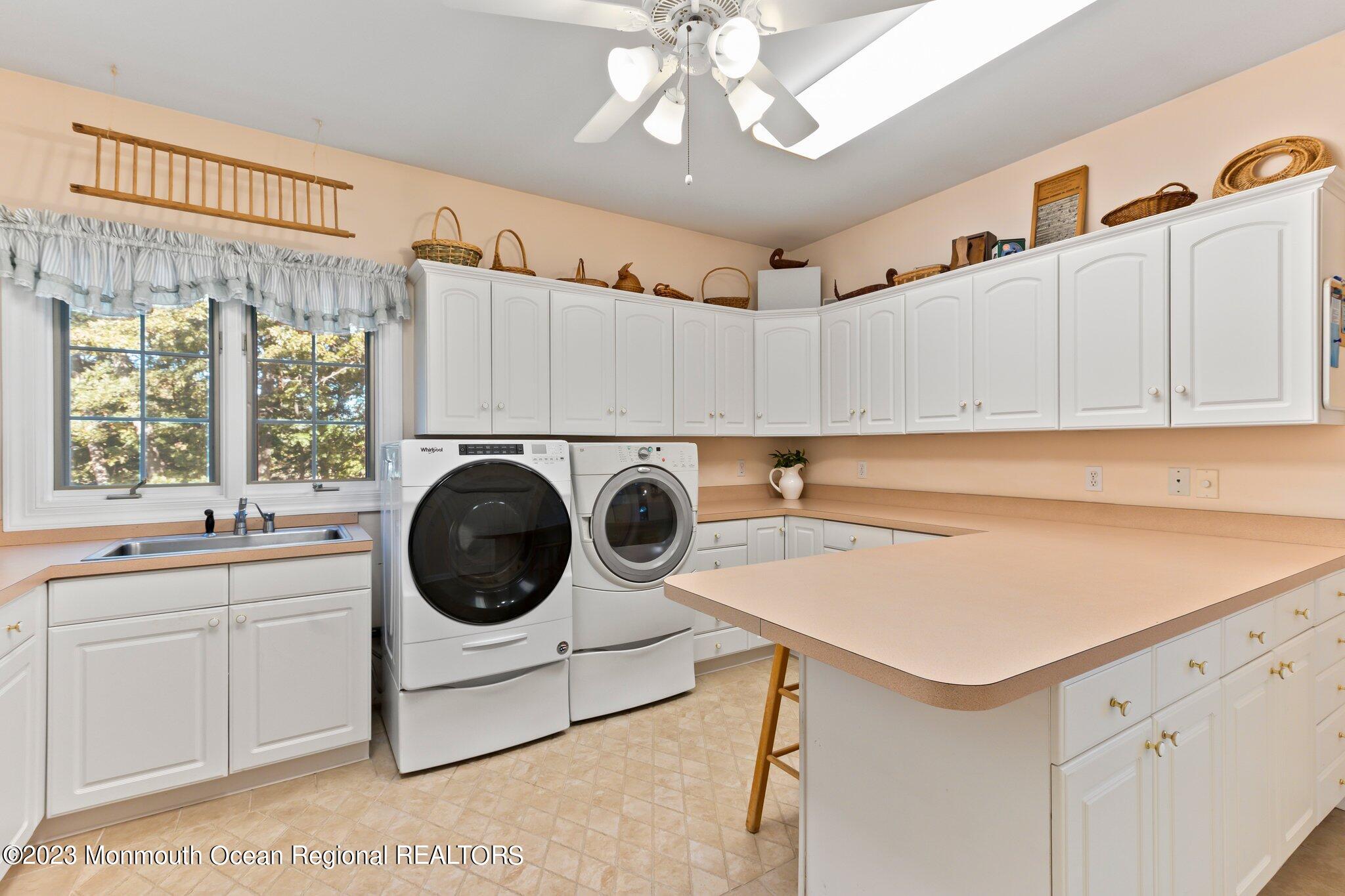 1841 Celeste Drive Wall, NJ 07719 - Photo 28 of 107 a utility room with sink dryer and washer