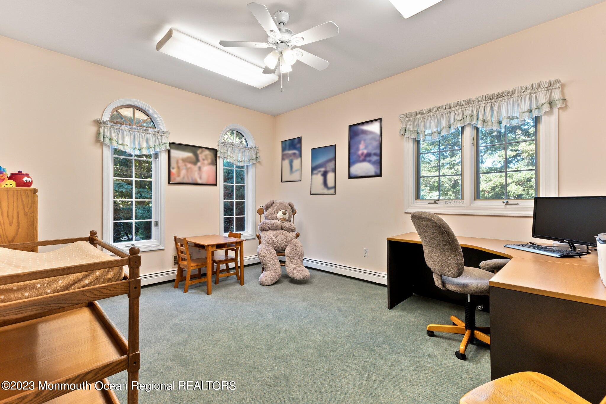 1841 Celeste Drive Wall, NJ 07719 - Photo 29 of 107 a view of a workspace with furniture and a window