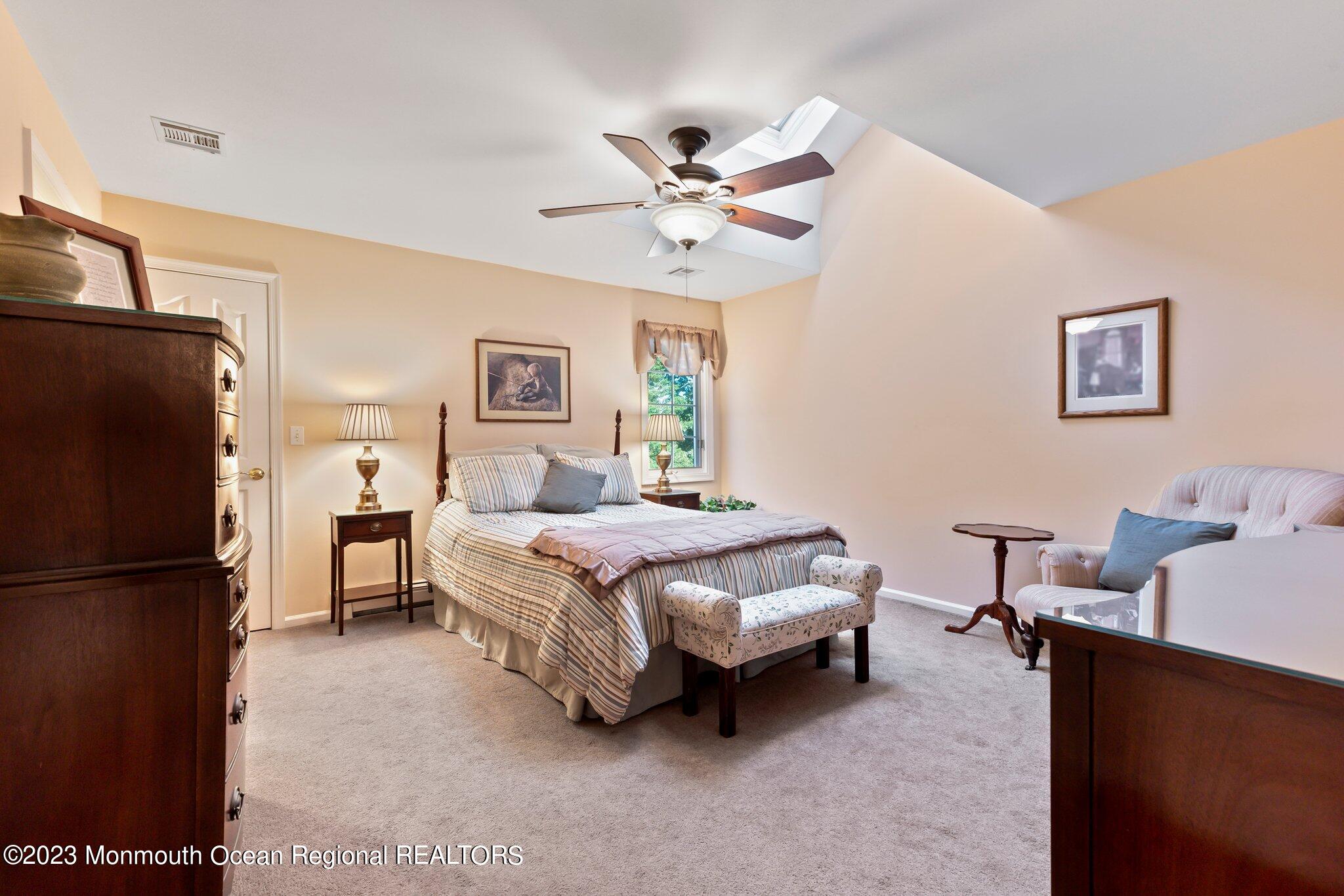 1841 Celeste Drive Wall, NJ 07719 - Photo 43 of 107 a spacious bedroom with a bed and a refrigerator