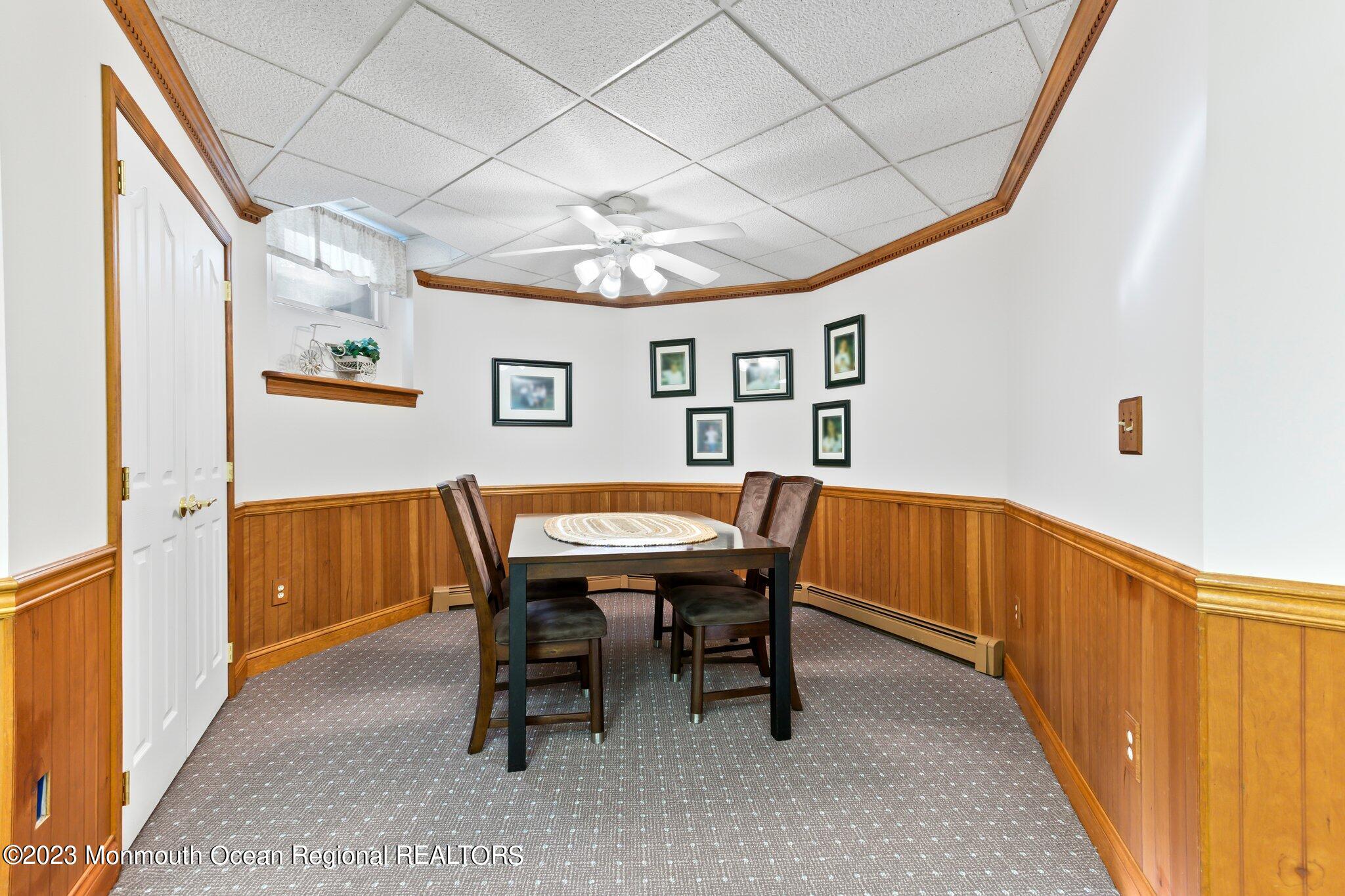 1841 Celeste Drive Wall, NJ 07719 - Photo 54 of 107 a view of a dining room with furniture and chandelier