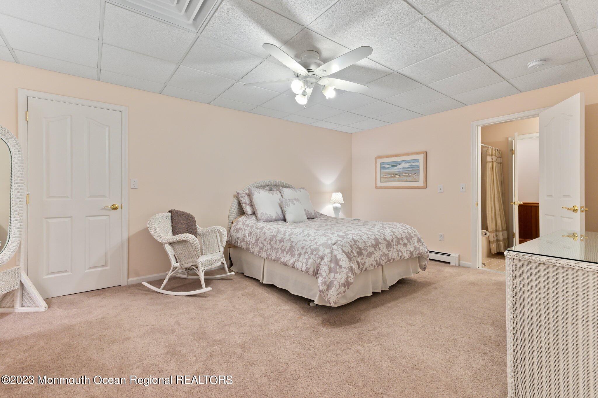 1841 Celeste Drive Wall, NJ 07719 - Photo 59 of 107 a bedroom with a bed and a chandelier