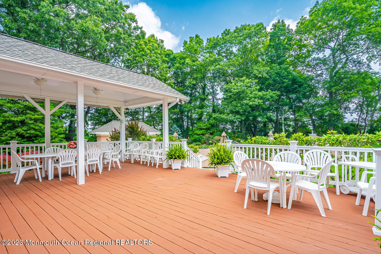 1841 Celeste Drive Wall, NJ 07719 - Photo 73 of 107 a view of a chairs and table on the wooden deck