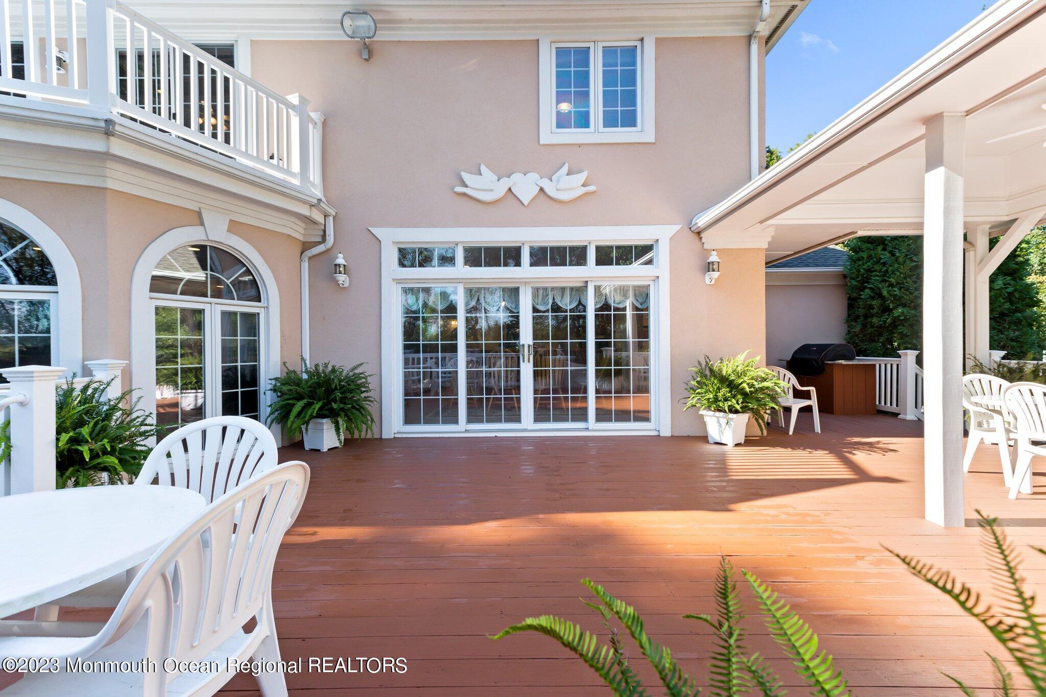 1841 Celeste Drive Wall, NJ 07719 - Photo 76 of 107 a front view of a house with a yard and potted plants