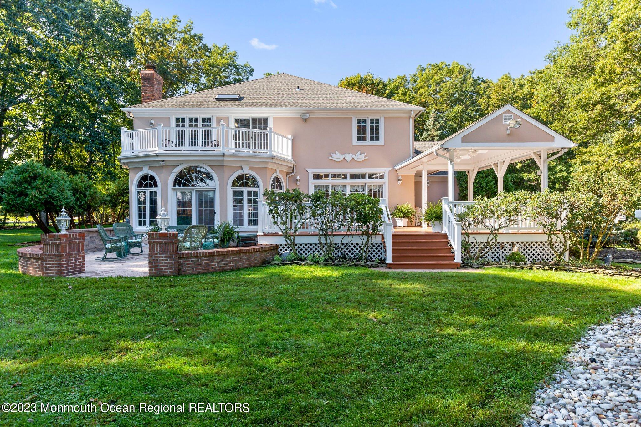1841 Celeste Drive Wall, NJ 07719 - Photo 80 of 107 a front view of a house with a garden and trees