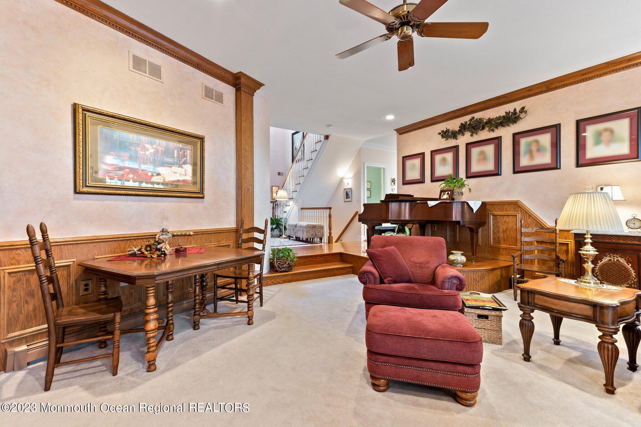 1841 Celeste Drive Wall, NJ 07719 - Photo 8 of 107 a living room with furniture a ceiling fan and a rug