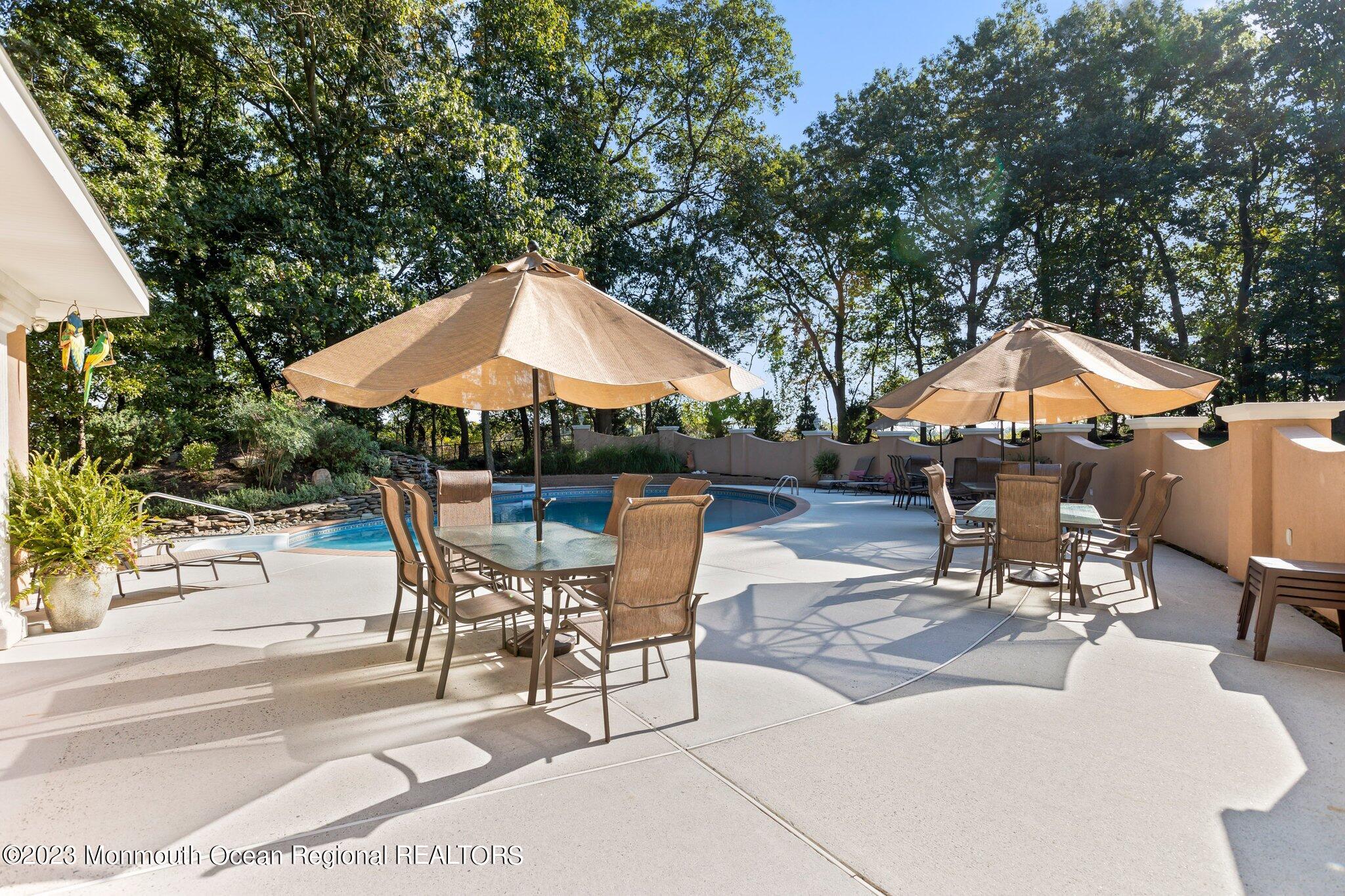 1841 Celeste Drive Wall, NJ 07719 - Photo 89 of 107 a patio with a patio table and chairs