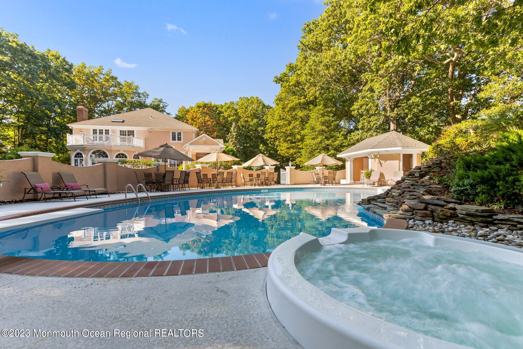 1841 Celeste Drive Wall, NJ 07719 - Photo 97 of 107 a view of a house with a yard and potted plants