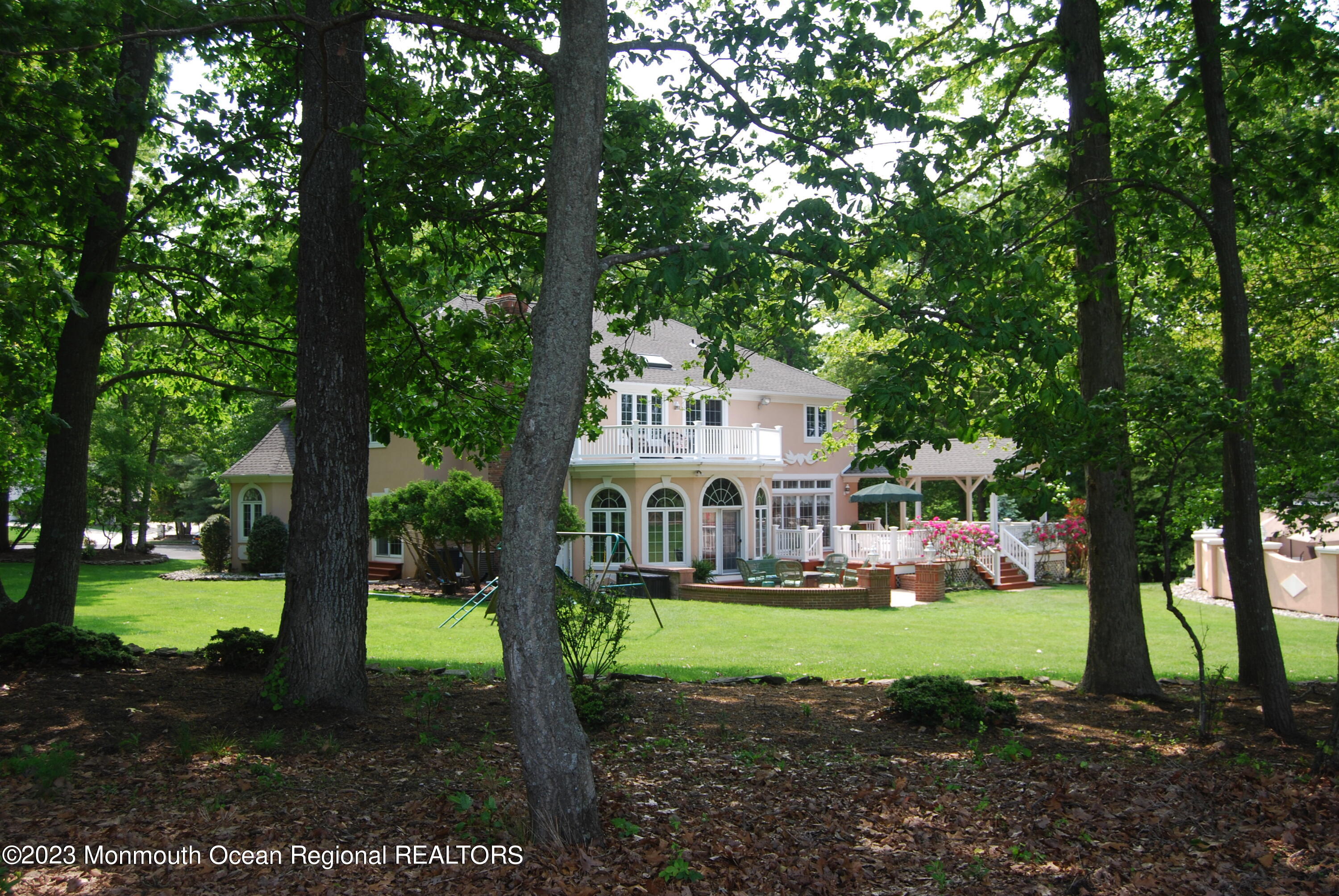 1841 Celeste Drive Wall, NJ 07719 - Photo 98 of 107 a front view of a house with a yard table and chairs