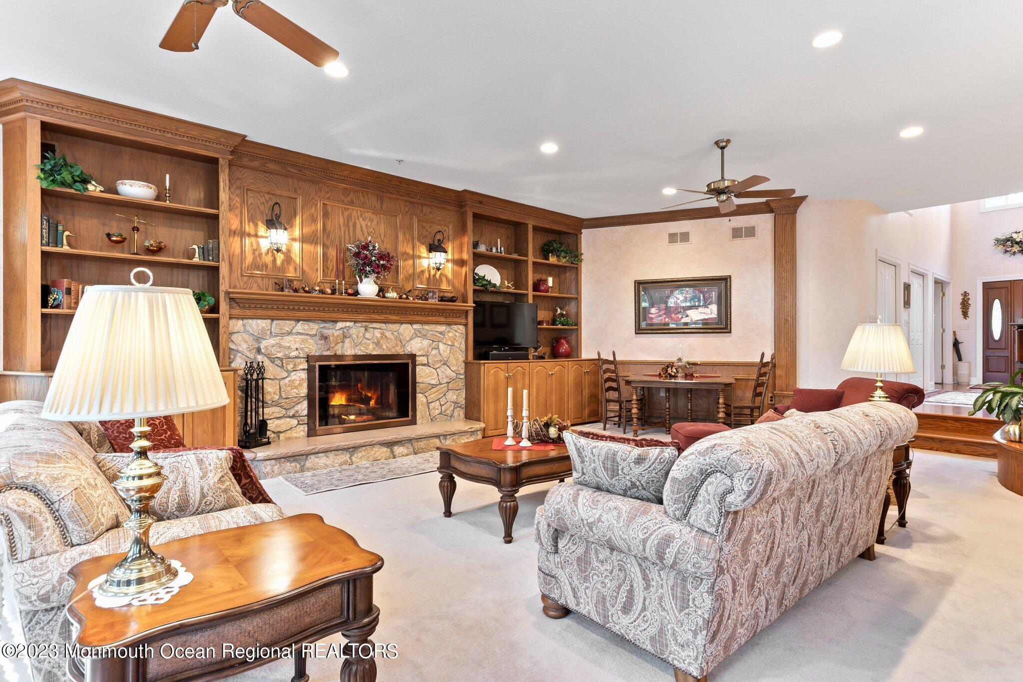 1841 Celeste Drive Wall, NJ 07719 - Photo 10 of 107 a living room with furniture and a fireplace