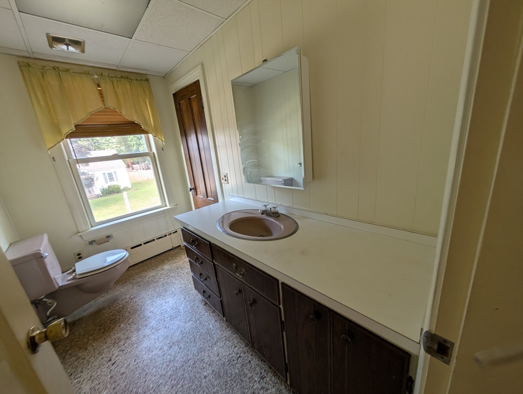 58 Ruggles Street Hardwick, MA 01031 - Photo 15 of 18 a bathroom with a sink a toilet and a mirror
