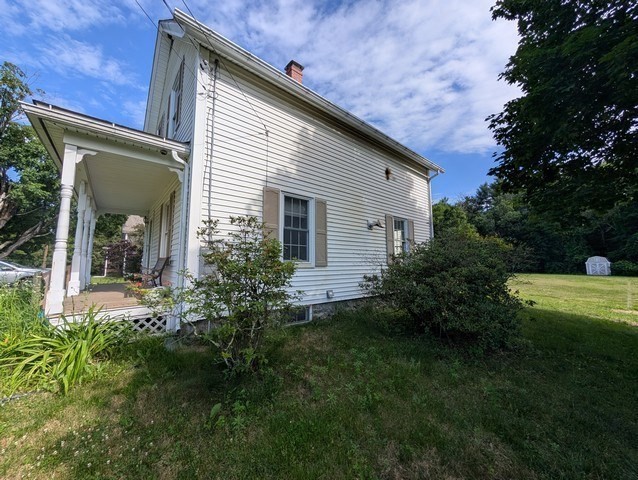58 Ruggles Street Hardwick, MA 01031 - Photo 2 of 18 a view of a house with a backyard