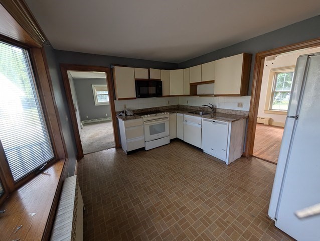 58 Ruggles Street Hardwick, MA 01031 - Photo 5 of 18 a large kitchen with stainless steel appliances granite countertop a stove a sink and a refrigerator