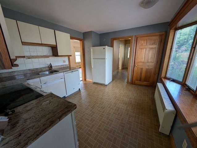 58 Ruggles Street Hardwick, MA 01031 - Photo 6 of 18 a kitchen that has a sink a stove and a refrigerator