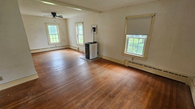 58 Ruggles Street Hardwick, MA 01031 - Photo 10 of 18 an empty room with wooden floor and windows