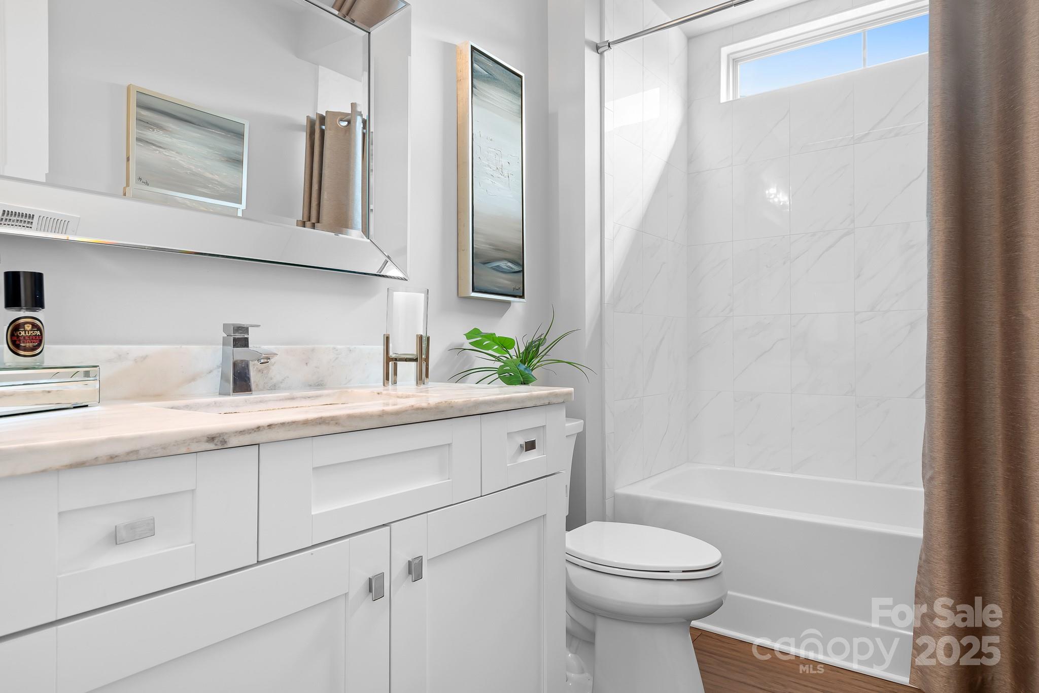 9223 Robbins Preserve Road Cornelius, NC 28031 - Photo 21 of 38 a bathroom with a sink a toilet and shower