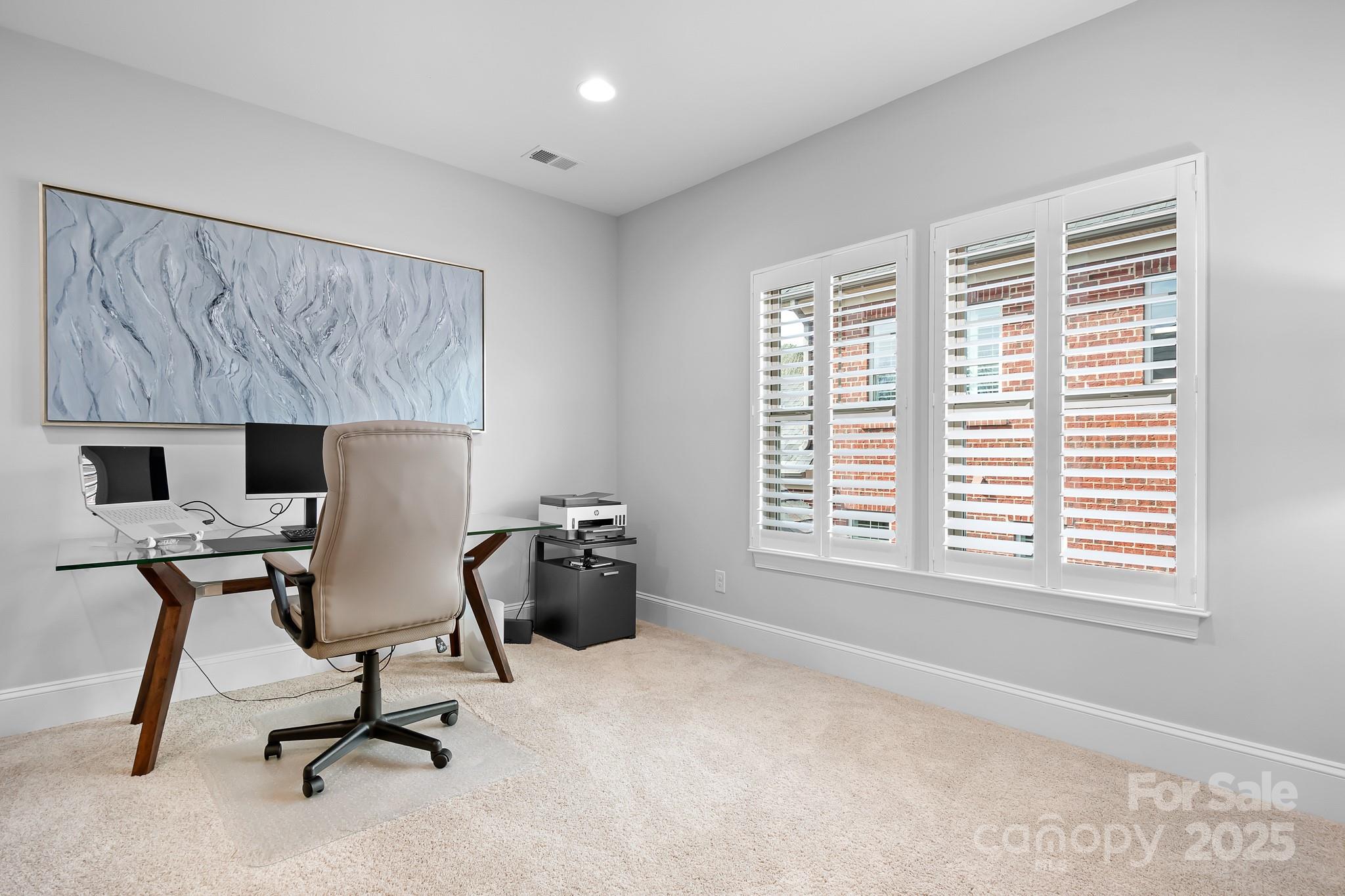9223 Robbins Preserve Road Cornelius, NC 28031 - Photo 24 of 38 a view of a workspace with furniture and a window