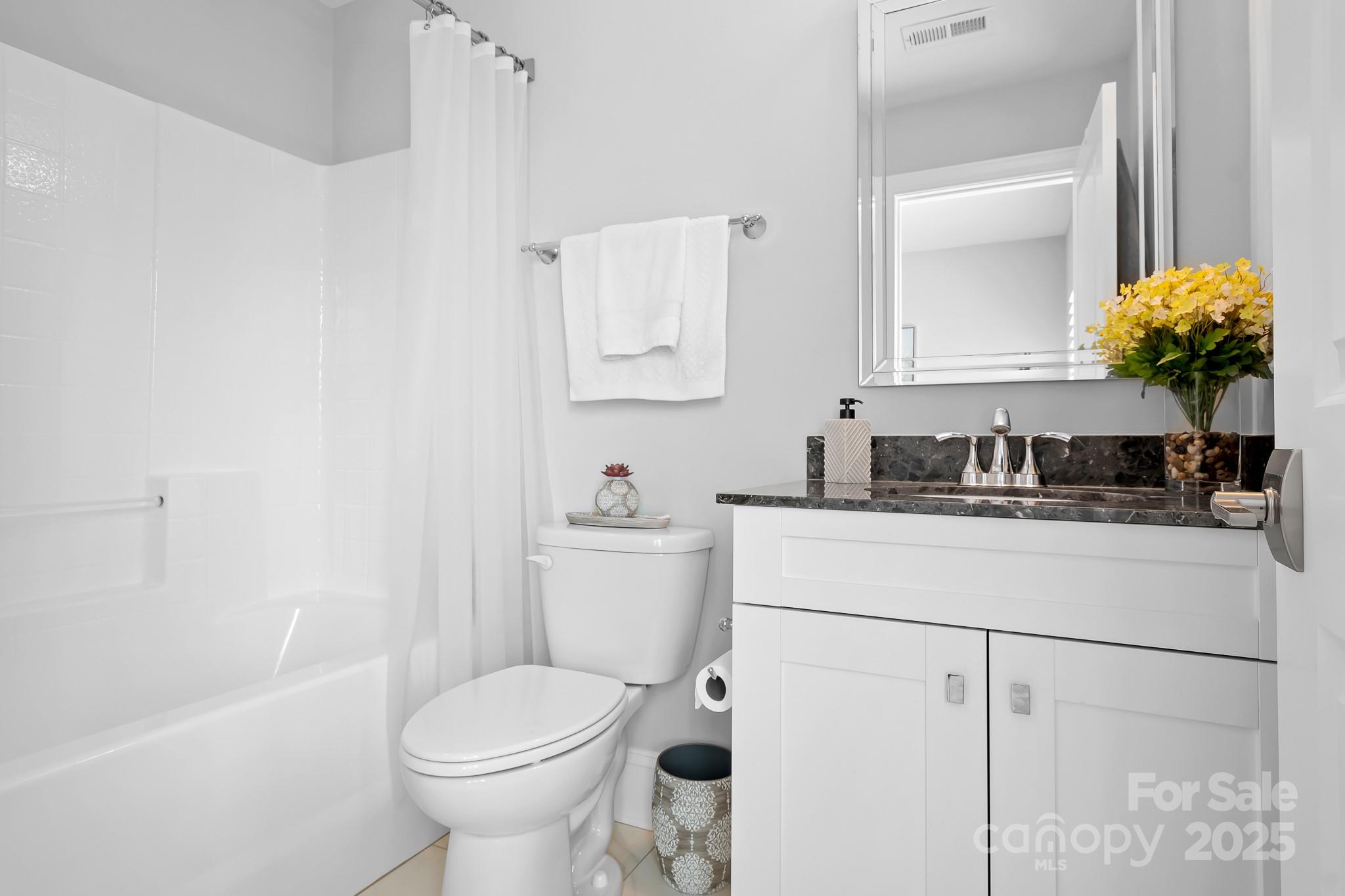 9223 Robbins Preserve Road Cornelius, NC 28031 - Photo 26 of 38 a bathroom with a sink toilet and mirror