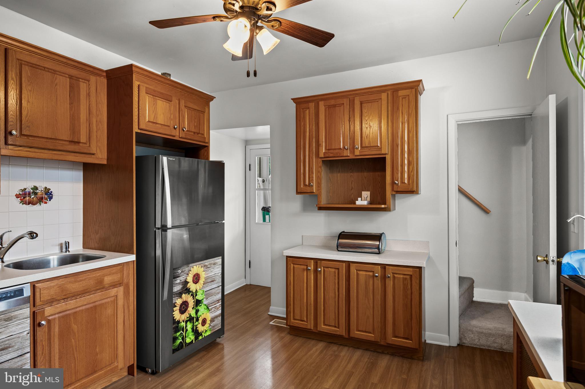 304 South Forklanding Road Maple Shade, NJ 08052 - Photo 8 of 29 a kitchen with stainless steel appliances granite countertop a refrigerator microwave and wooden floor