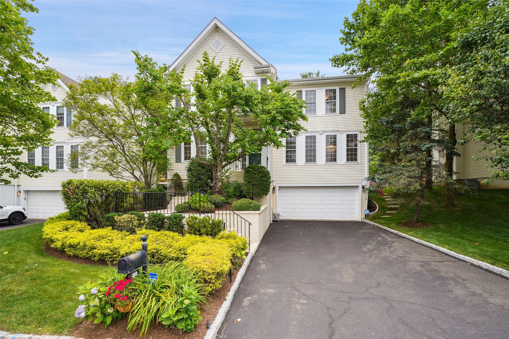 a view of house with backyard and garden