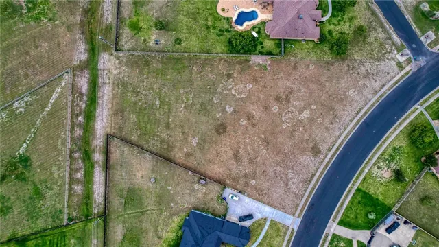 a view of a field with an ocean