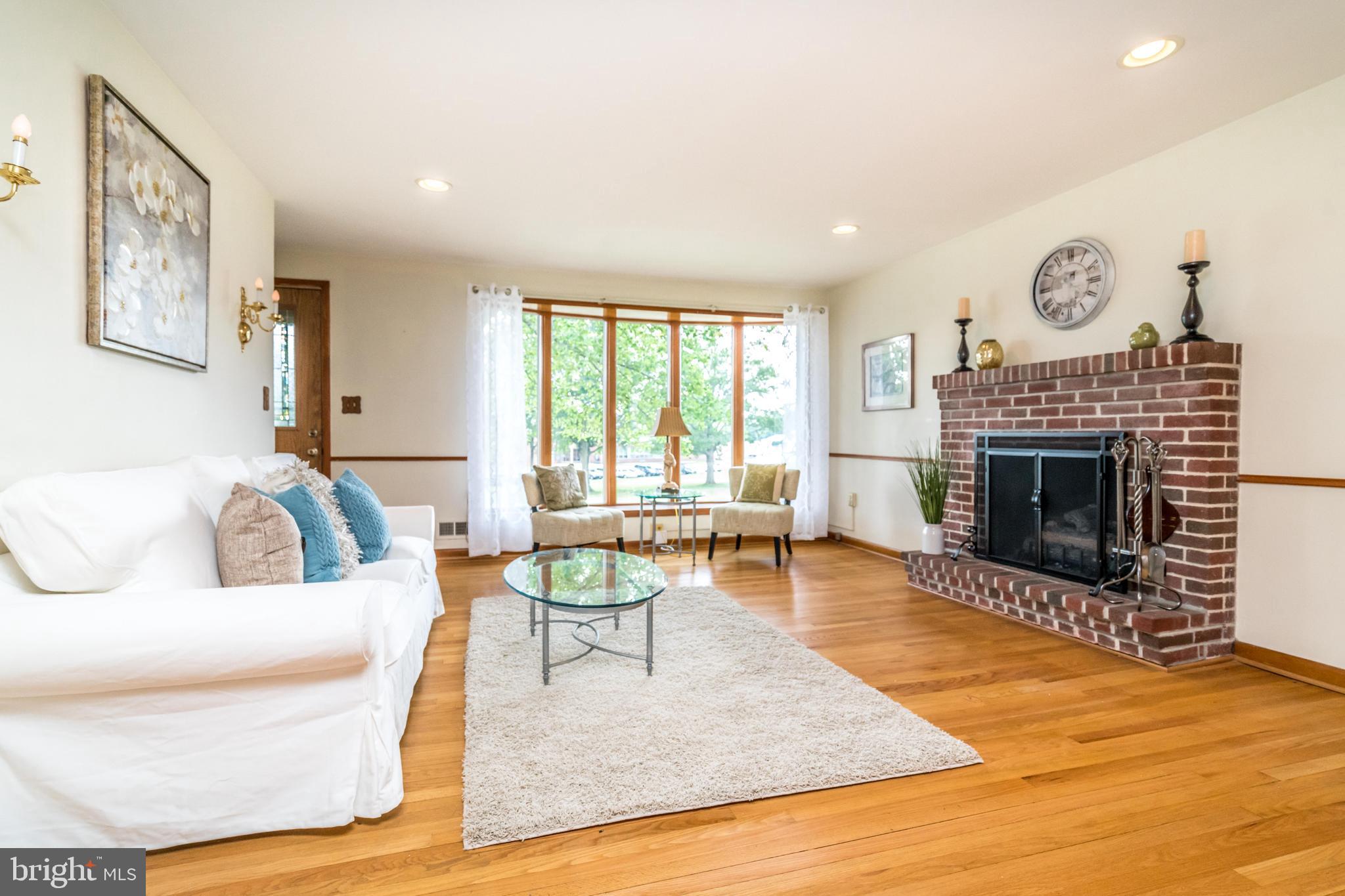 8702 Avondale Road Baltimore, MD 21234 - Photo 3 of 30 Gas fireplace and bay window