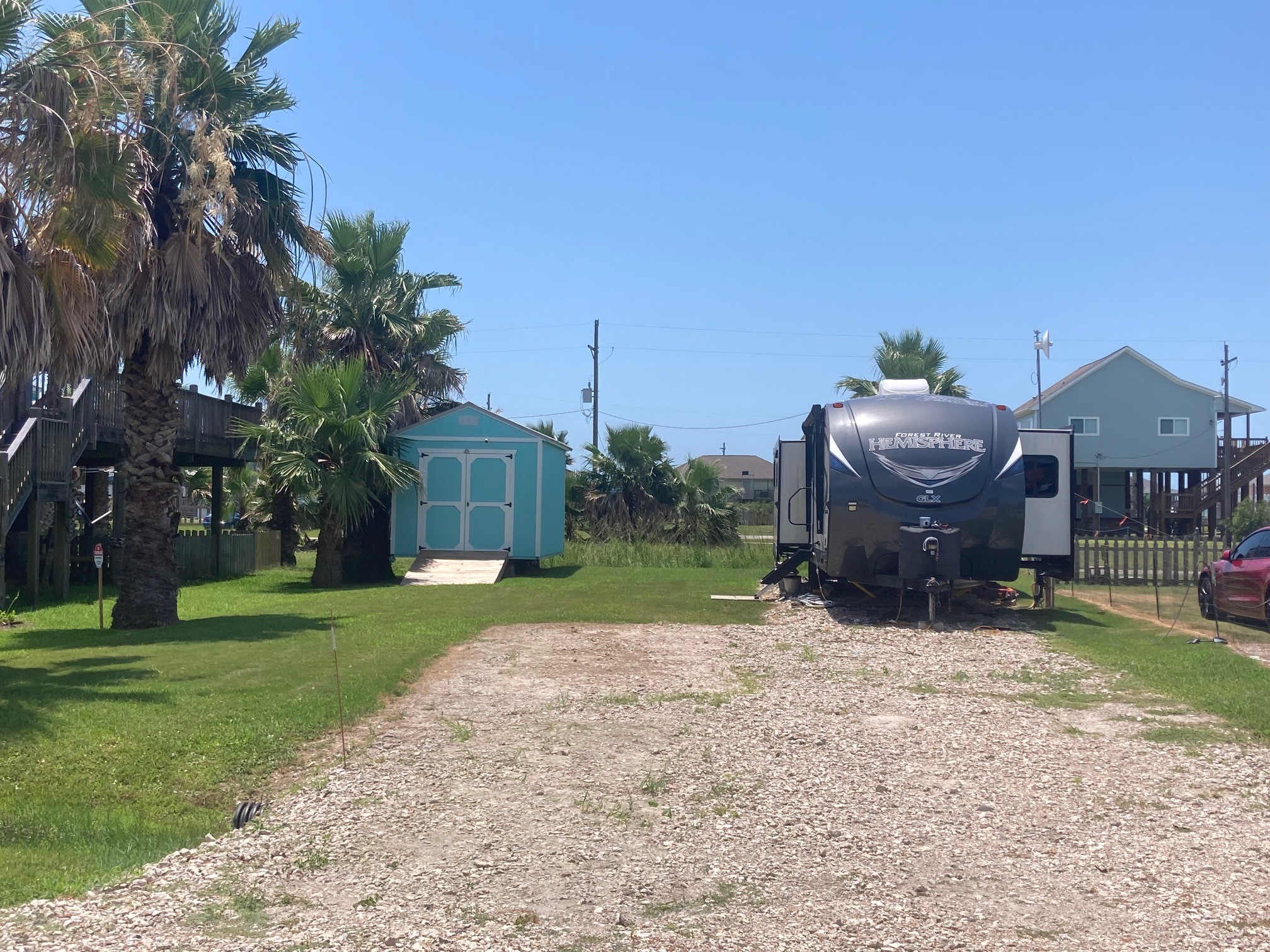 108 Mae Circle Crystal Beach, TX 77650 - Photo 16 of 22 a view of a house with a yard and tree s