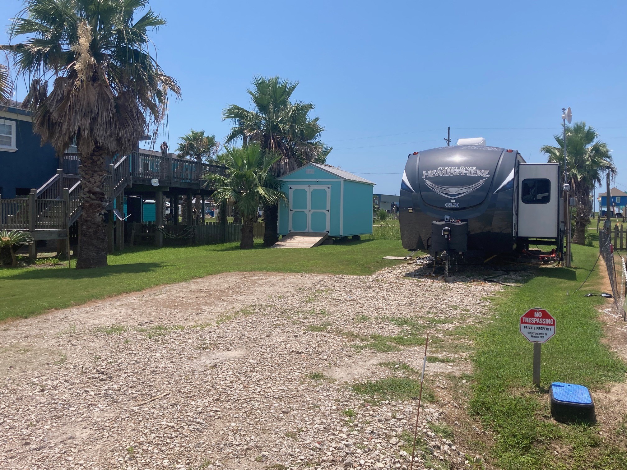108 Mae Circle Crystal Beach, TX 77650 - Photo 18 of 22 a backyard of a house with table and chairs