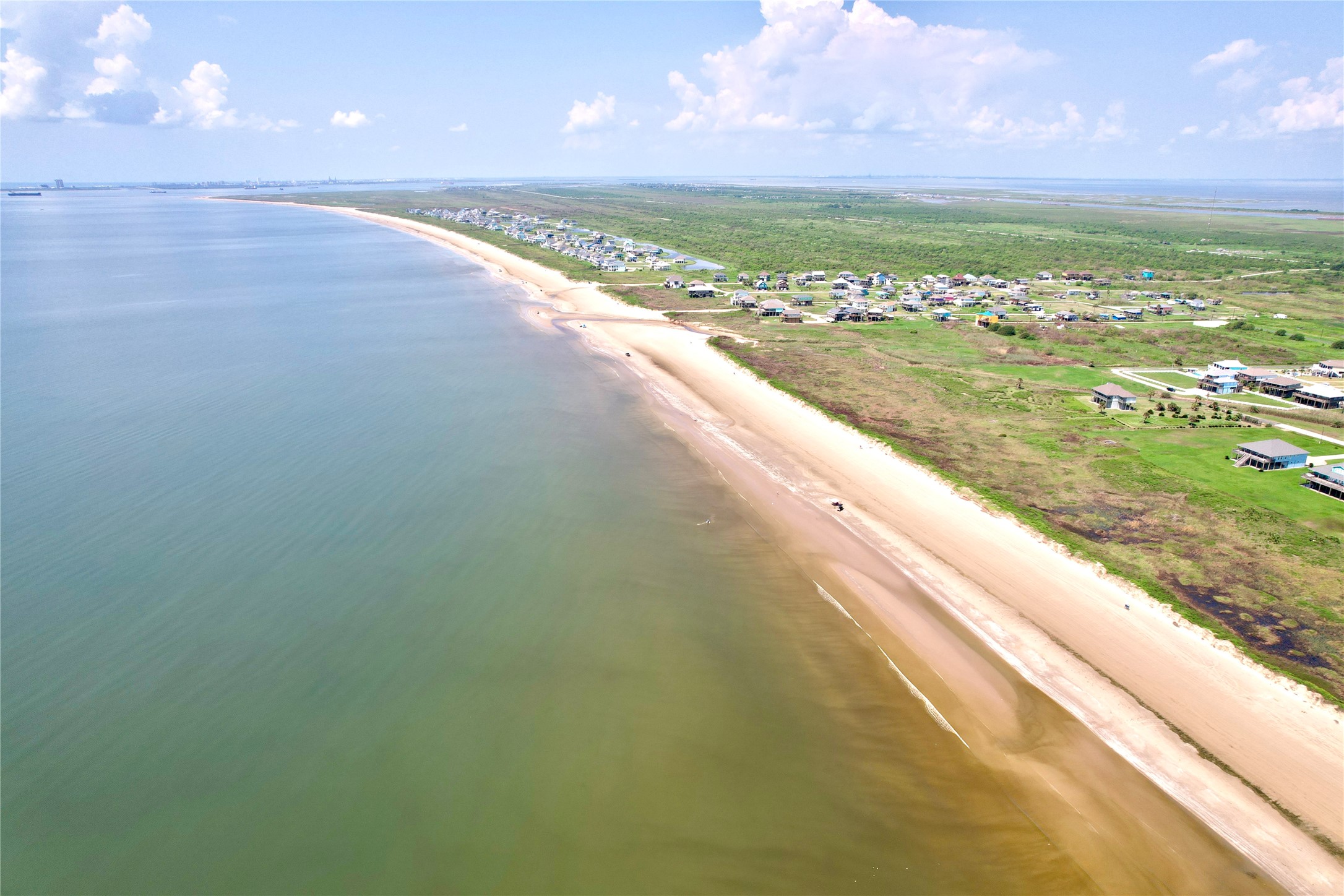 108 Mae Circle Crystal Beach, TX 77650 - Photo 20 of 22 a view of an ocean and a yard