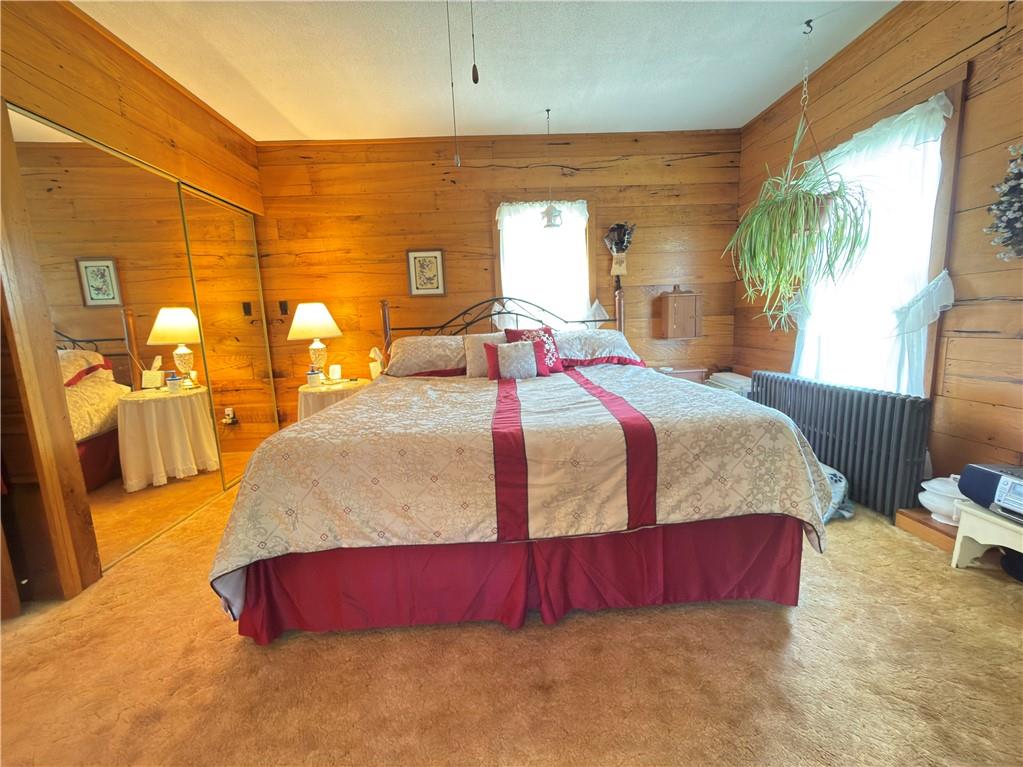 122 Coal Bank Road Greenville, PA 16125 - Photo 46 of 50 a bedroom with a bed and a large window