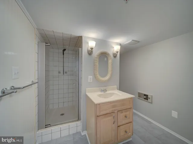 a view of a kitchen with white cabinets
