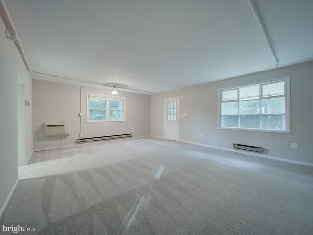 a view of a room with wooden walls