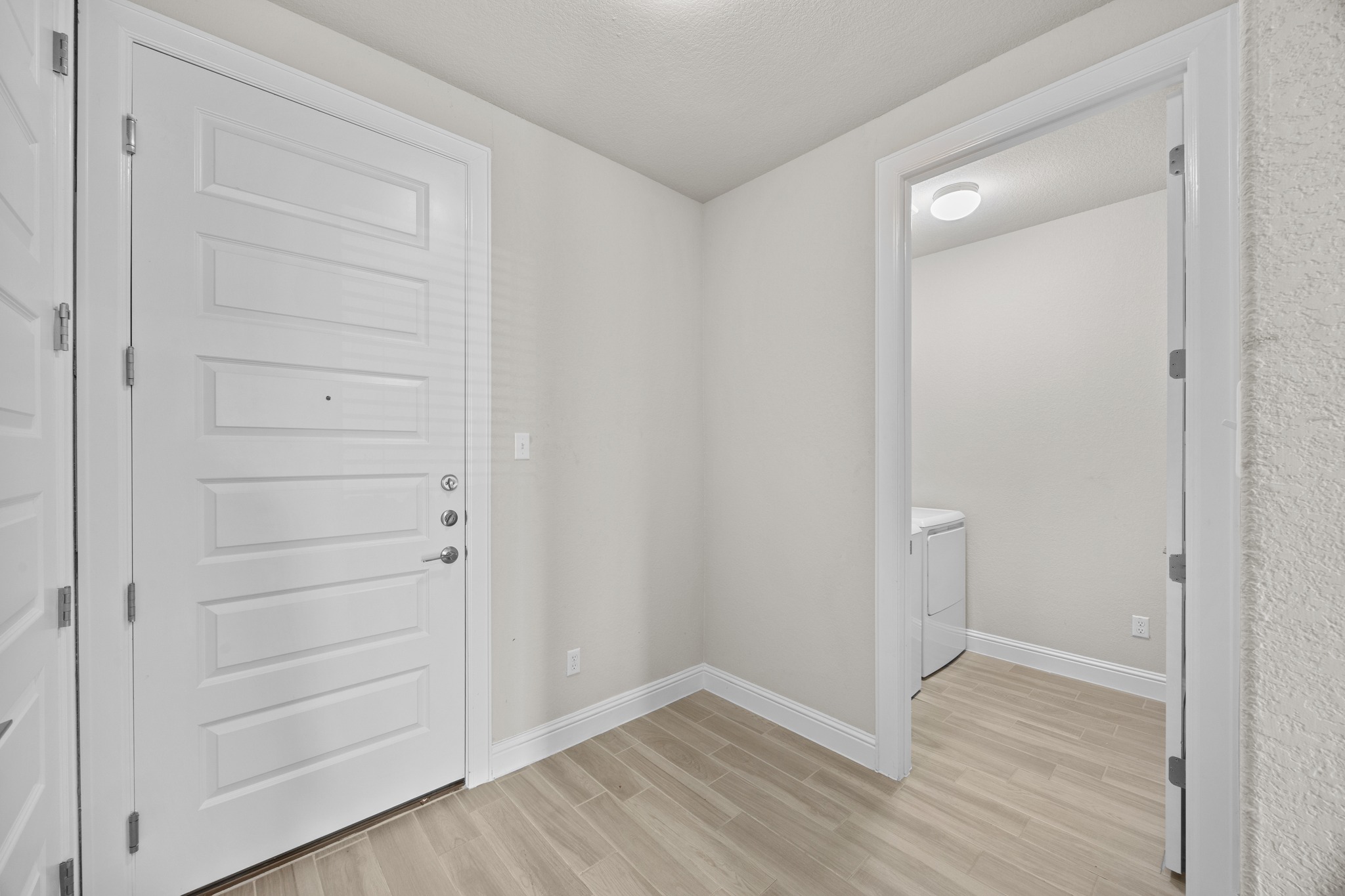 213 Graver Street Georgetown, TX 78626 - Photo 17 of 33 Garage entry and laundry room space.