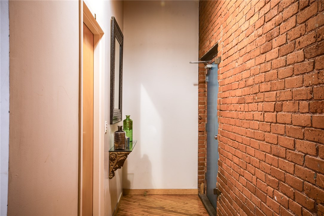 116 Chestnut Street, Unit J1 Providence, RI 02903 - Photo 4 of 22 The unit has its own hallway with a closet that houses the unit's washer and dryer.
