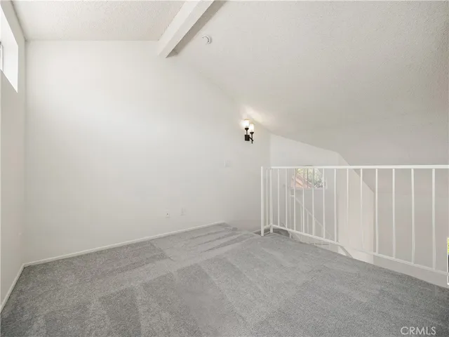 a bathroom with a tub sink shower and mirror