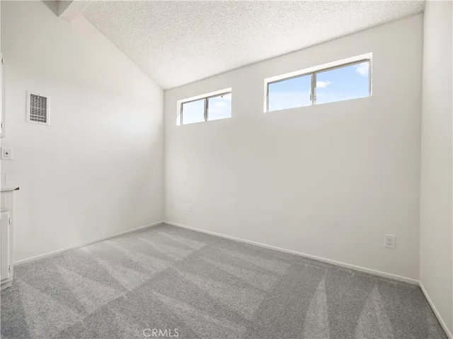 a bathroom with a sink a toilet a large mirror and shower