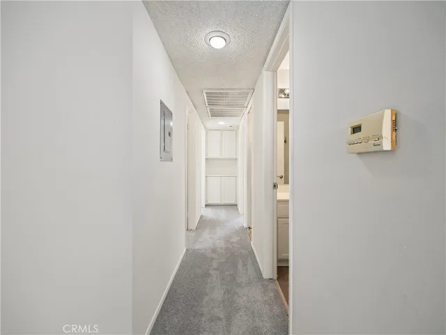 a white toilet and tub sitting next to a bathroom sink