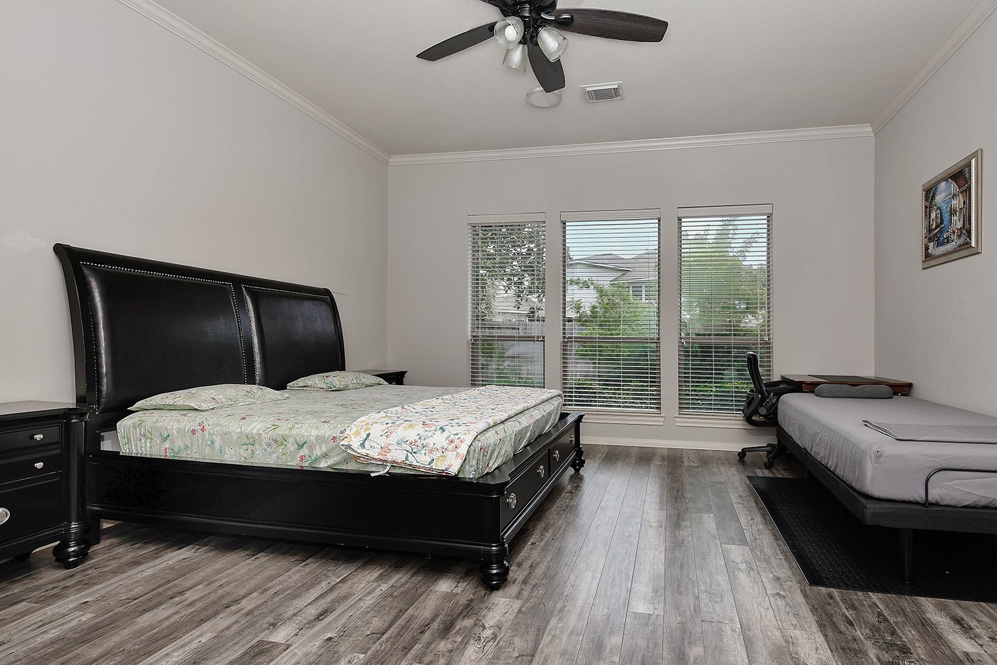 18722 Duke Lake Drive Spring, TX 77388 - Photo 13 of 26 a bedroom with a bed and wooden floor