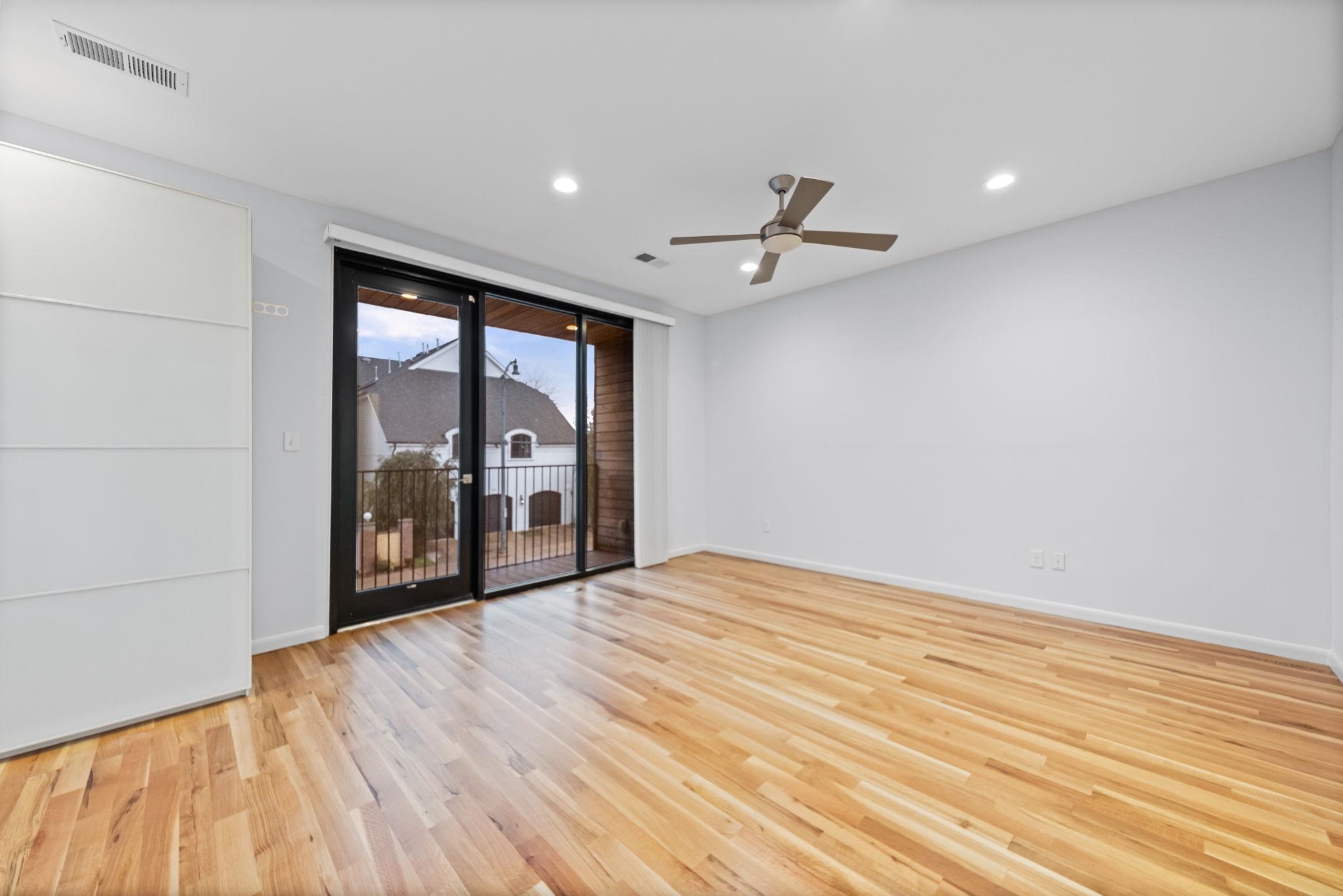 448 Tennessee Street Memphis, TN 38103 - Photo 17 of 39 Spacious room featuring wood-finish flooring, recessed lighting, and a contemporary ceiling fan