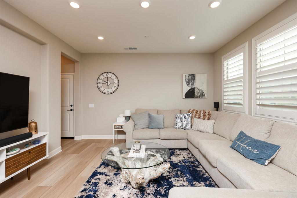 1112 Delpy View Point Vista, CA 92084 - Photo 11 of 62 a living room with furniture and a flat screen tv