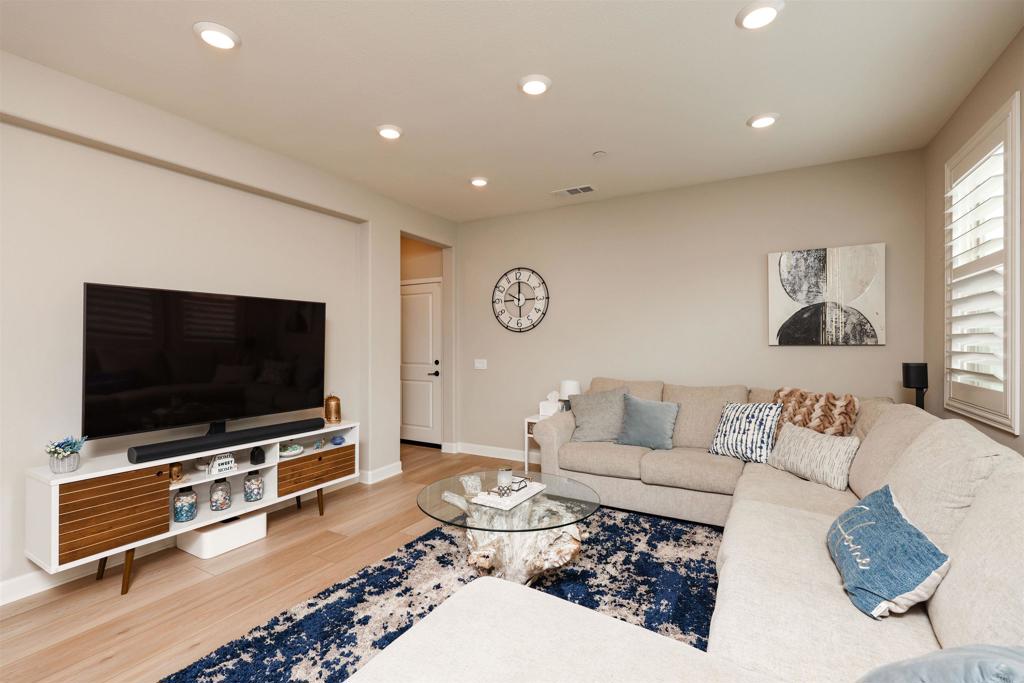 1112 Delpy View Point Vista, CA 92084 - Photo 12 of 62 a living room with furniture and a flat screen tv