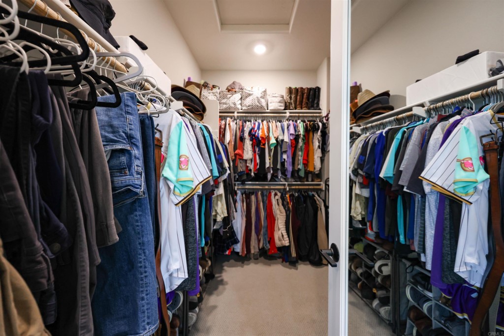 1112 Delpy View Point Vista, CA 92084 - Photo 26 of 62 a view of walk in closet with clothes