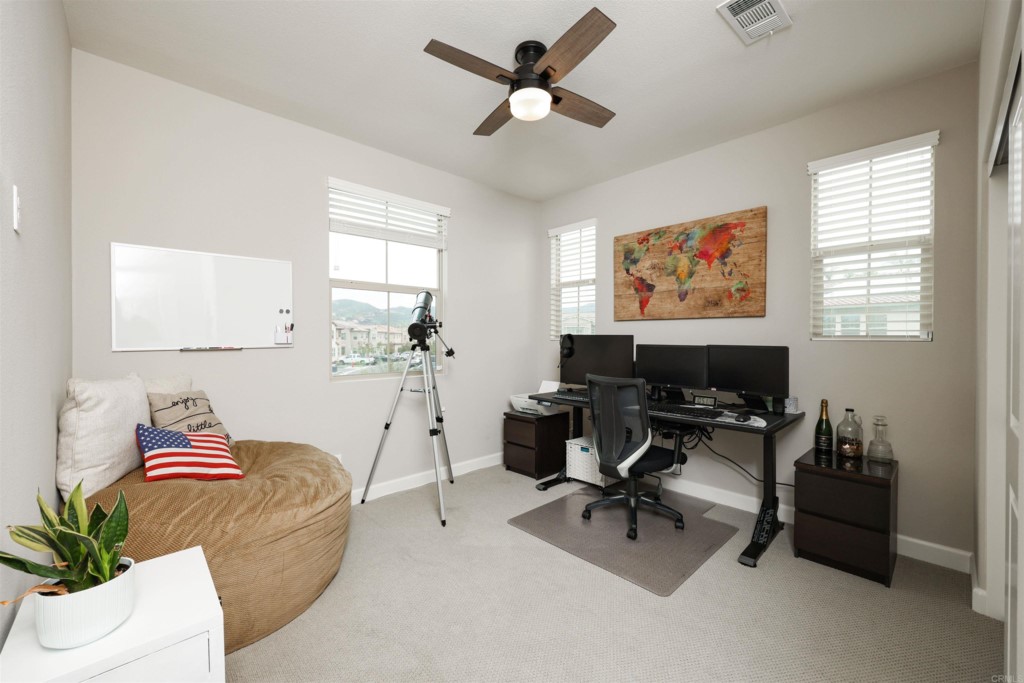1112 Delpy View Point Vista, CA 92084 - Photo 30 of 62 a living room with furniture and a flat screen tv