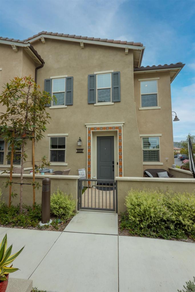 1112 Delpy View Point Vista, CA 92084 - Photo 3 of 62 a front view of a house with a yard