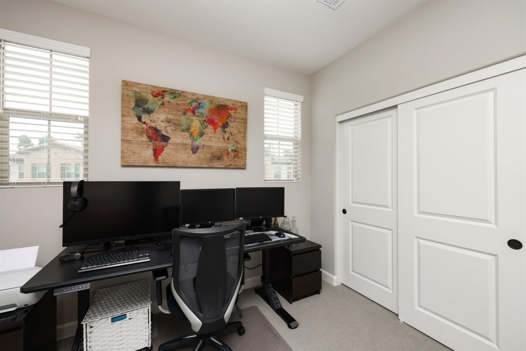 1112 Delpy View Point Vista, CA 92084 - Photo 32 of 62 a view of a workspace with furniture and a window