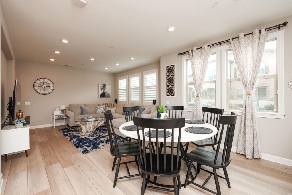 1112 Delpy View Point Vista, CA 92084 - Photo 39 of 62 a dining room with wooden floor and furniture