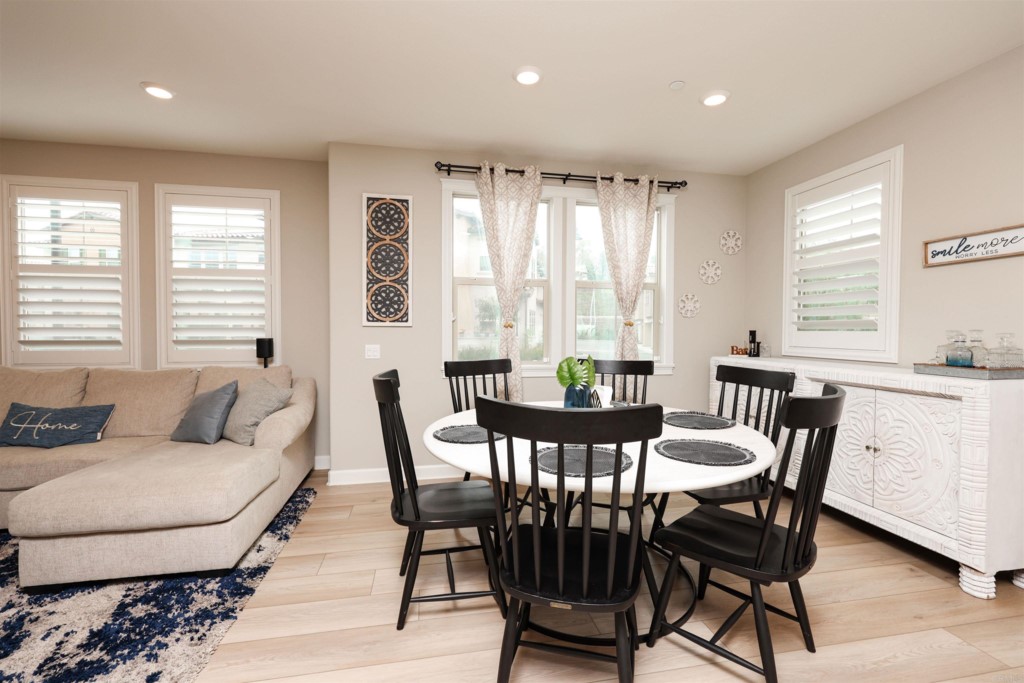 1112 Delpy View Point Vista, CA 92084 - Photo 40 of 62 a view of a dining room with furniture and windows