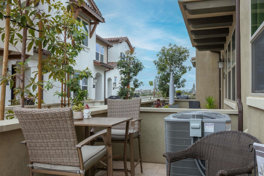 1112 Delpy View Point Vista, CA 92084 - Photo 43 of 62 a view of a patio with table and chairs and potted plants