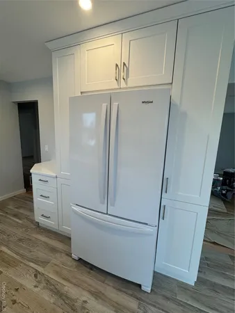 a view of empty room with a fireplace